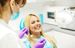 person smiling at the dentist’s 