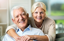 Close-up of a senior man and woman smiling