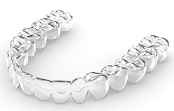 A clear Invisalign aligner in Orange Park