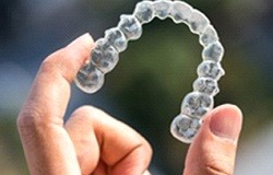 Person holding Invisalign in Orange Park