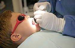 Child receiving dental treatment