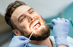 Patient receiving oral cancer screening