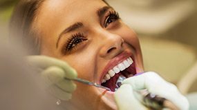 Woman receving dental treatment