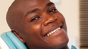 Smiling man in dental chair