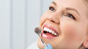 Woman receving dental exam