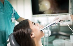 Female dental patient receiving intraoral photos