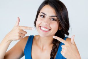 woman smiling pointing