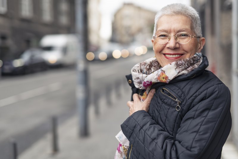 Woman smiling after cosmetic dentistry