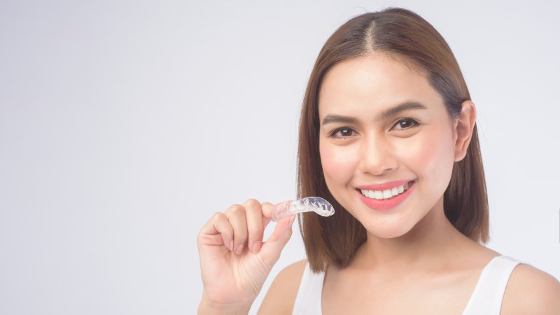 woman smiling with Invisalign in Orange Park