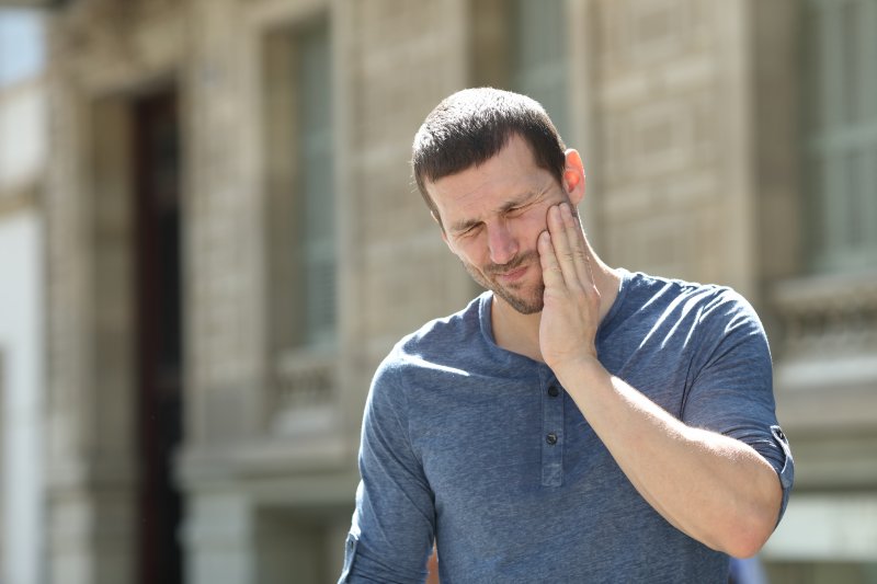 A man with jaw pain on one side