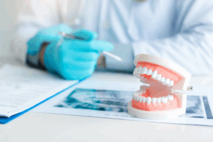 a close-up of dentures and a dental X-ray