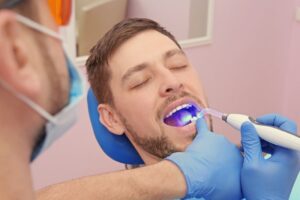Man getting a tooth-colored filling placed