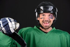 Hockey player smiling and revealing missing teeth.